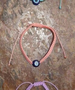 evil eye bracelets in different colours on a brown background