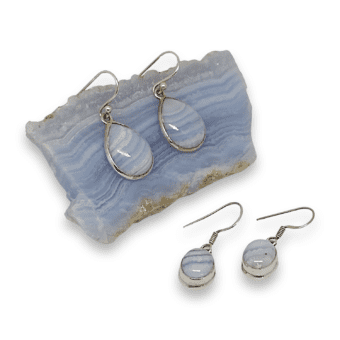 for sale tow pairs of drop earrings featuring blue lace agate and sterling silver. Displayed with blue lace agate crystal on a white back ground