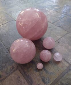 Alternative view of Natural crystals: cut and polished Rose Quartz Spheres