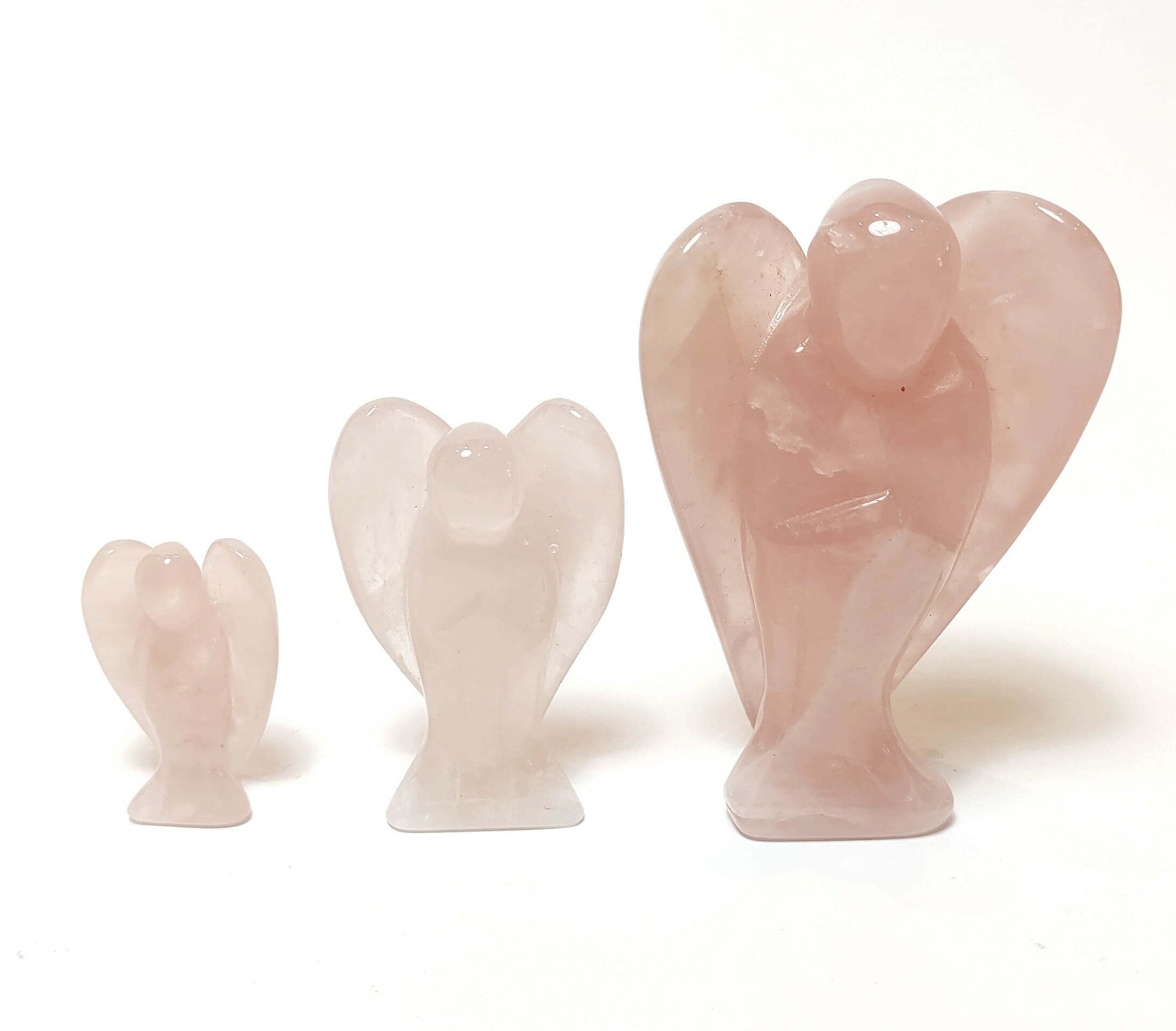 Natural crystals: hand carved and polished Rose Quartz Angels (available in three sizes)
