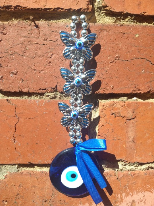 Evil Eye: Silver Beaded Ribbon Hanger with Butterfly Detail